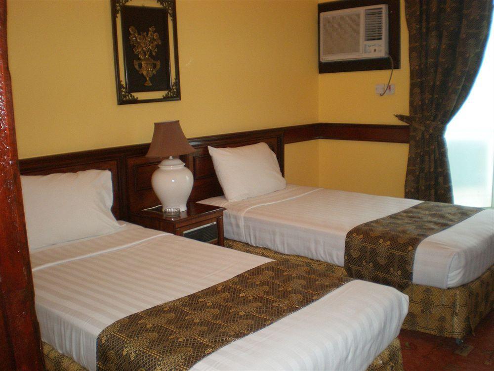 Concord International Hotel Manama Quarto foto